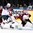 MINSK, BELARUS - MAY 15: USA's Craig Smith #15 with a scoring chance against Latvia's Kristers Gudlevskis #50 while Jekabs Redlihs #14 looks on during preliminary round action at the 2014 IIHF Ice Hockey World Championship. (Photo by Andre Ringuette/HHOF-IIHF Images)

